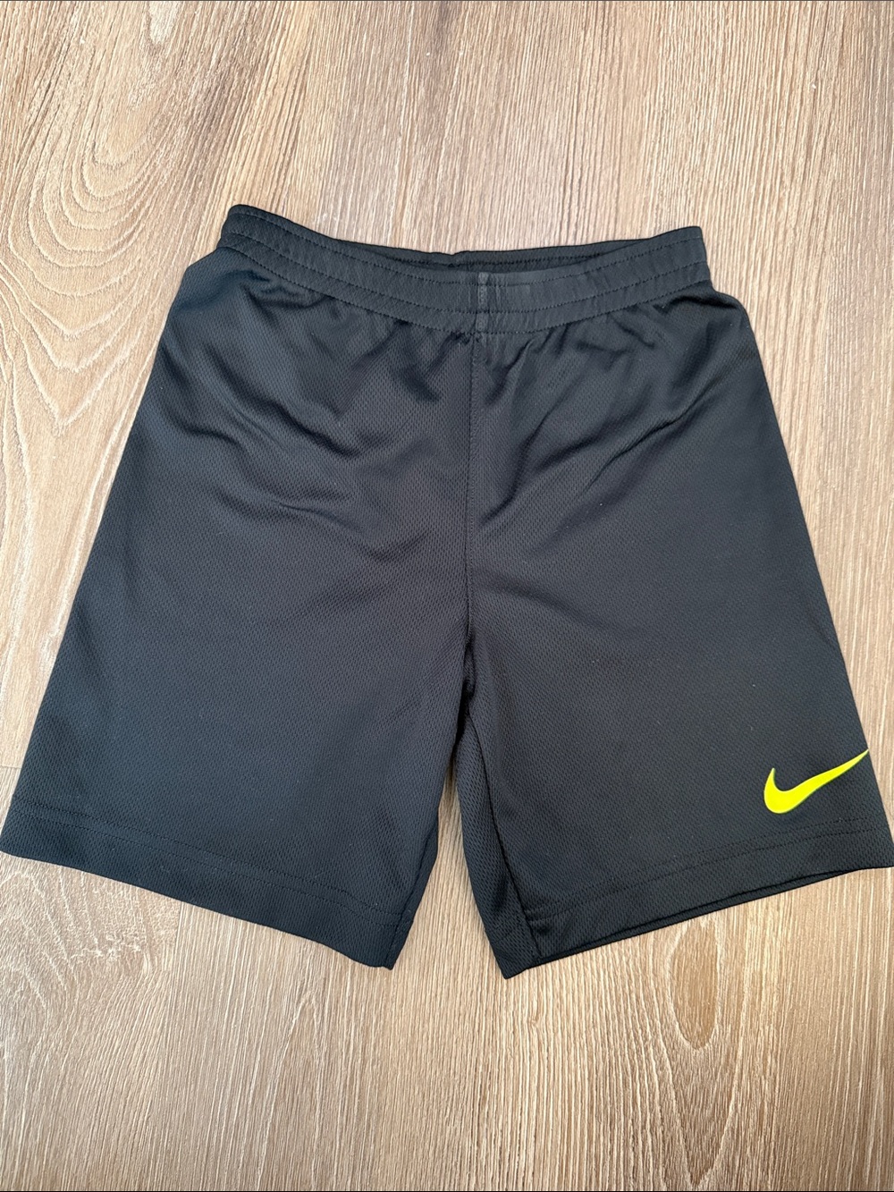 Nike Boy’s Black Athletic Shorts with Neon Yellow Swoosh - size 7/Large